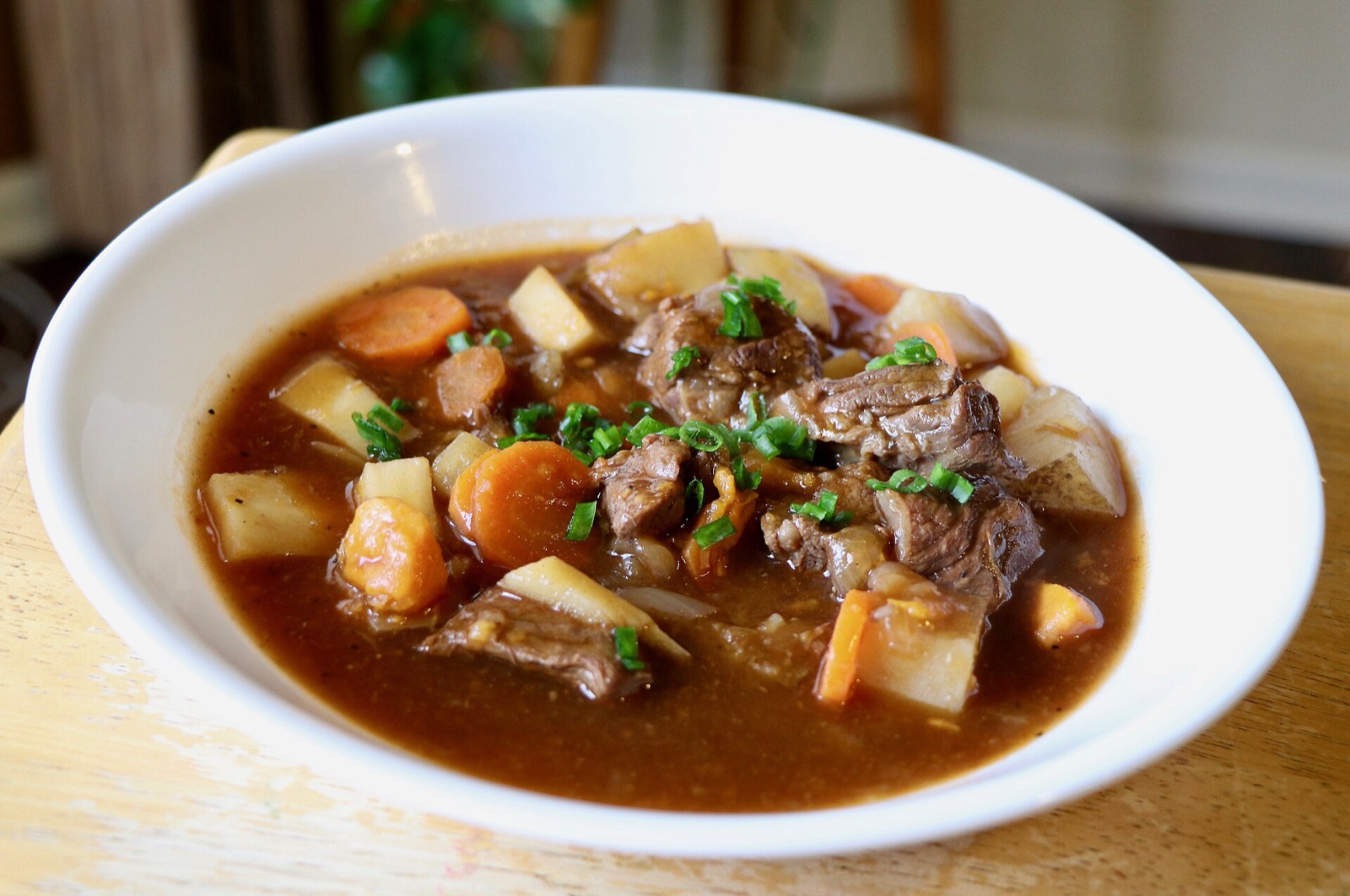 A bowl of slow-cooked Irish stew with lamb, carrots and potato